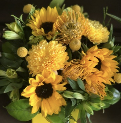 Myles of Smiles - This bouquet is a great gift for those with pets, Sunflowers and Carnations are the main flowers used to create this bouquet.