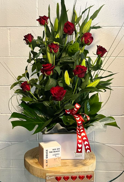 With Love - A romantic gesture that will show the love intended when sending this lily and rose flower arrangement, candle and chocolates. Candle fragrances are selected due to availability. -
