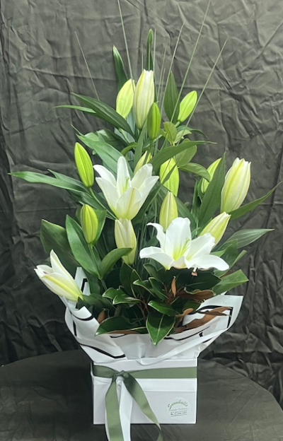 SNOWBALLS SPLENDOUR - One of our top products, lasting beautiful oriental lilies that will fill a room with its fragrance. This design suits all occasions with its sophisticated flare.