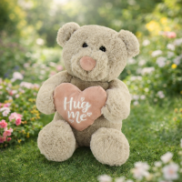 Hug Me Bear - That’s a very sweet little teddy with soft brown fur, a pink heart, and that “Hug Me” message that practically leans in for a cuddle. It radiates comfort in a way only plush toys can.